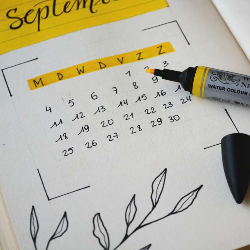 Calendar with days highlighted and open highlighter in view, where local events can be marked.